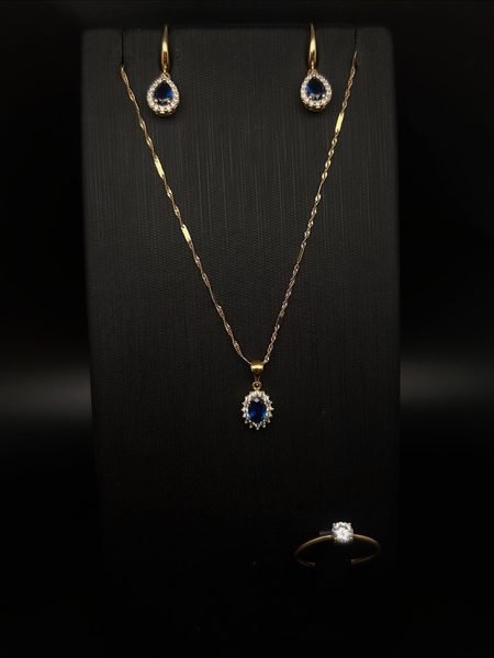 Parure en or : collier avec pendentif à pierre bleue et boucles d'oreilles assorties